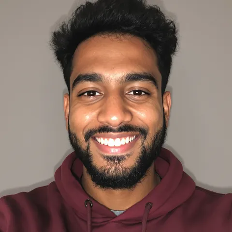 The original selfie: a grinning man in a maroon hoodie